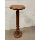 A lamp stand or plant stand with turned pillar support
