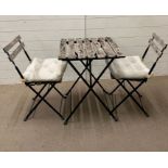 A Bistro set with wooden slats on metal frame by IKEA Tarno