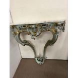 A marble topped Rococo frame with scrolling leaf decoration (H94cm W87cm D36cm)