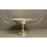 A two handled silver centrepiece on a single foot, by Charles Edwards, hallmarked for London 1909 (