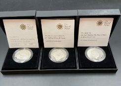 Three Royal Mint silver proof coins: 2008 UK Queen Elizabeth 1 £5, 2010 Restoration of the