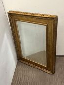 A gilt frame foxed mirror 59cm x 76cm