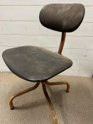 A Tan Sad industrial style posture chair