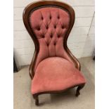 A Victorian style nursing chair with pink button back upholstery