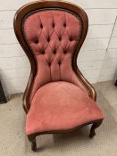 A Victorian style nursing chair with pink button back upholstery