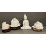 A selection of decorative Buddhas on plinths to include three ceramic and one resin.