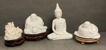 A selection of decorative Buddhas on plinths to include three ceramic and one resin.