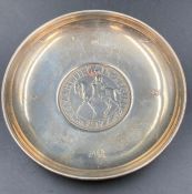 A silver pin tray celebrating the Queens Silver Jubilee with central coin.