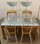 A painted kitchen table with six chairs