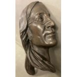 A bronze bust or wall hanging of John Lennon in profile, signed by the artist Jeanne Rynhart