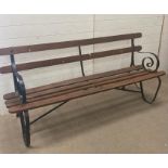A wrought iron garden bench with wooden slats (H80cm W180cm)
