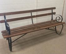 A wrought iron garden bench with wooden slats (H80cm W180cm)