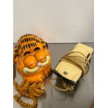 Two novelty phones, Garfield and a model of a car