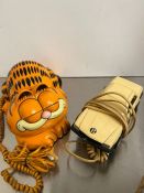 Two novelty phones, Garfield and a model of a car