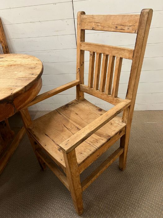 An oval rustic pine table with three drawers, four chairs and two carvers (H75cm W200cm D100cm) - Image 4 of 5