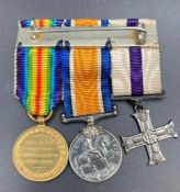 A WWI Military miniature set of Military Cross and Bar, British War, and Victory Medal