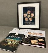 A framed collection of coins celebrating the 200th Anniversary of the battle of Waterloo to