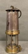 An antique brass miners lamp