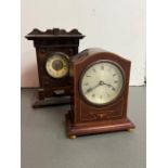 An inlay mantle clock on bun feet and an oak case mantle clock