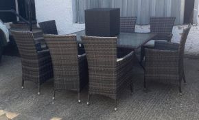 A rattan eight seat garden table and chairs with small side table (H74cm W150cm D100cm)