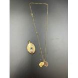 9ct gold locket on a necklace and a separate locket (Approximate total weight is 7.2g)