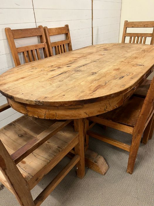 An oval rustic pine table with three drawers, four chairs and two carvers (H75cm W200cm D100cm) - Image 3 of 5