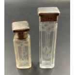Two silver topped glass bottles