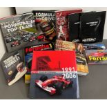 A selection of Formula 1 racing reference books, mostly in Spanish.