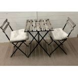 A Bistro set with wooden slats on metal frame by IKEA Tarno
