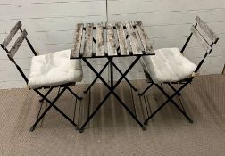 A Bistro set with wooden slats on metal frame by IKEA Tarno