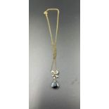 A 9ct gold necklace with blue stone pendant (Approximate Weight 3g)