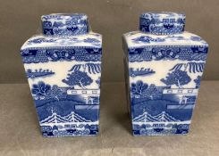A pair of blue and white ginger jars