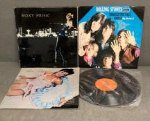 A selection of vintage vinyl records to include Roxy Music, Santana and Rolling Stones