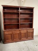 A library book case with four cupboards under and adjustable shelves (H220cm W200cm D40cm)