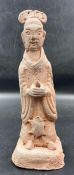 An antique Chinese terracotta figure, marked to base