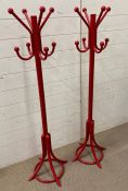 A pair of red child's coat stands (H130cm)