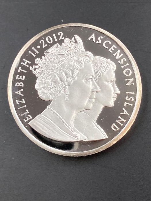 A Pobjoy Mint Elizabeth II Ascension Island £5 silver proof coin with Queens Head in relief. - Image 2 of 3