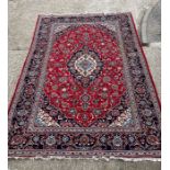 A Persian Keshaun red rug 370cm x 242cm
