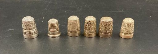 A selection of six Charles Horner Thimbles, some silver and some plated steel