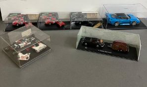 Six diecast constructors cars and other diecast cars in display boxes