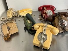 Seven vintage phones, various colours and style