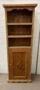 A pine open bookcase with cupboard under (H160cm W56cm D33cm)