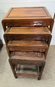 A hardwood nest of tables with moulded frieze and geometric motif (53cm x 58cm)