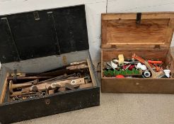 A selection of vintage tools in a wooden storage box