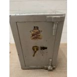 A metal safe with key (H63cm W40cm)