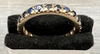 A Sapphire eternity ring in a platinum setting (Size M)