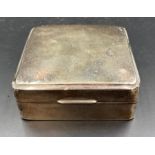 A hallmarked silver cigarette box, hallmarked for Birmingham