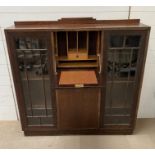 An oak secretary side by side display cabinet