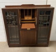 An oak secretary side by side display cabinet