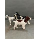 Three Beswick ceramic dogs to include spaniels (H18cm tallest)